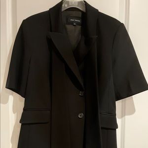 Pink tartan blazer. With attached fringed scarf.